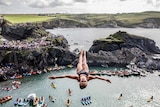 Helena Merten dives from a 20-metre platform at the Blue Lagoon in Pembrokeshire, Wales.