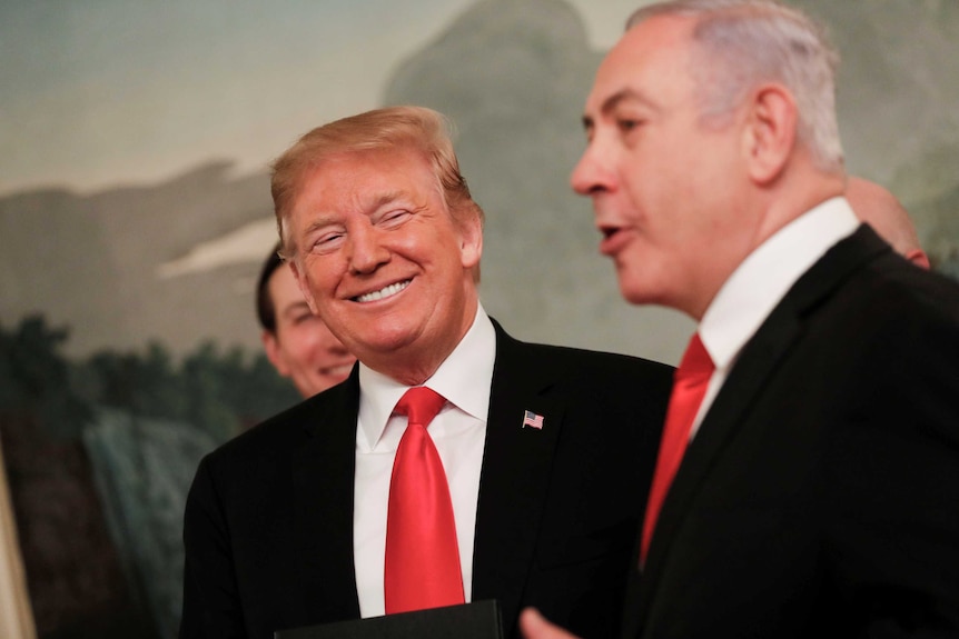 Donald Trump smiling broadly as Benjamin Netanyahu speaks