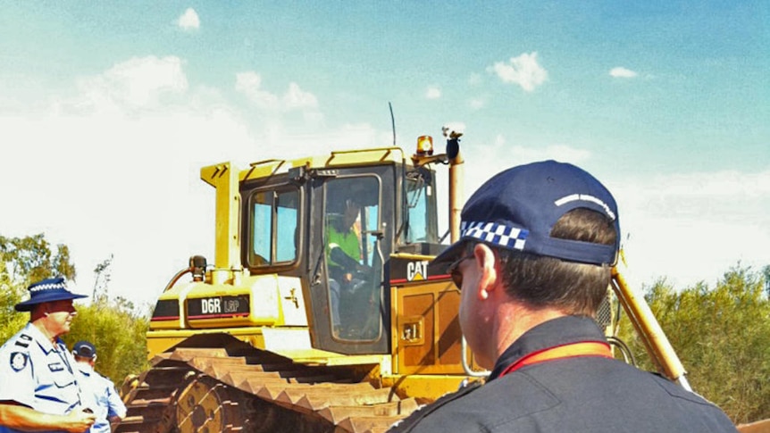Police guarded a bulldozer as it made its way to James Price Point, site of the gas hub (file)
