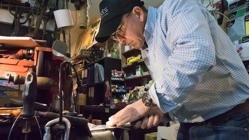 John Davis knife sharpening at his Rozelle newsagents