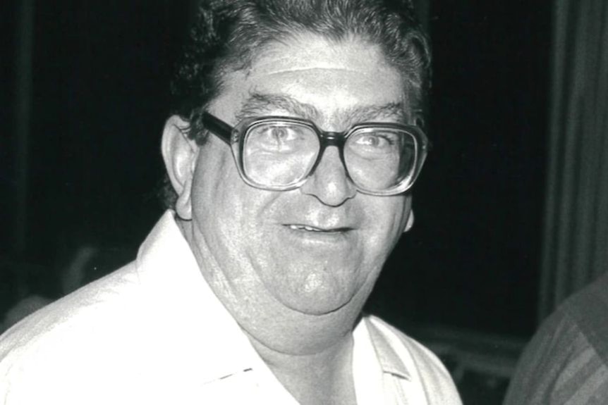 black and white photo of a man in glasses