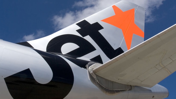 Jetstar aircraft with orange logo on the tail