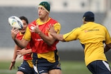 Nathan Sharpe passes the ball during the Wallabies captain's run in Christchurch