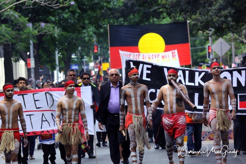 Muggera dancers with Bob Morgan lead the march, for the state funeral of Solomon Bellear AM.