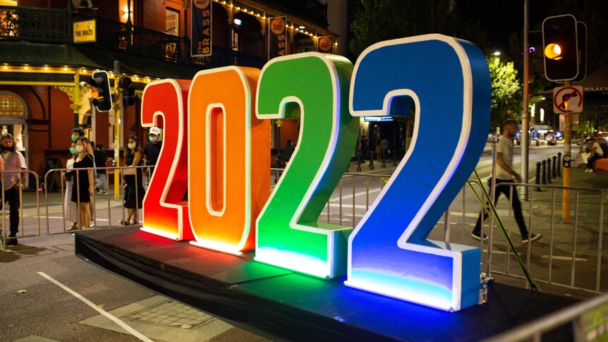 A colourful 2022 sign stands on William Street in Northbridge.