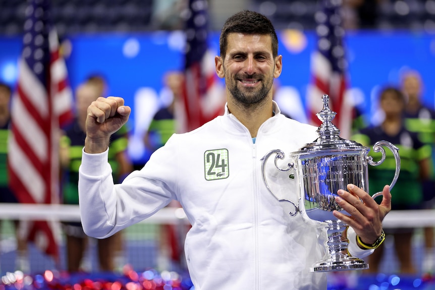 Novak Djokovic holds a silver trophy