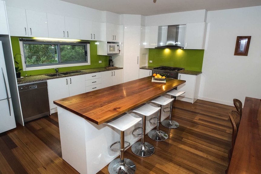 A modern kitchen with timber floors