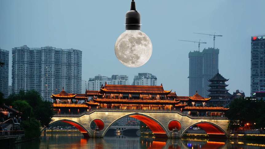 A moon, which replaces the globe in a light globe, hangs over Chengdu's cityscape.