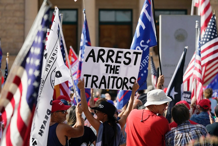 Supporters of President Donald Trump rally outside the Arizona state capitol.