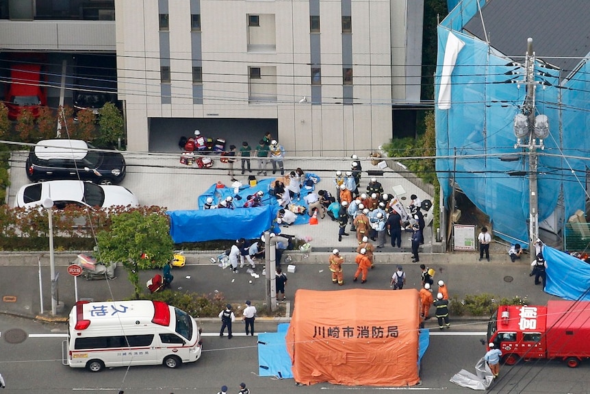 An aerial photo shows the scene of a stabbing attack with emergency services busily working