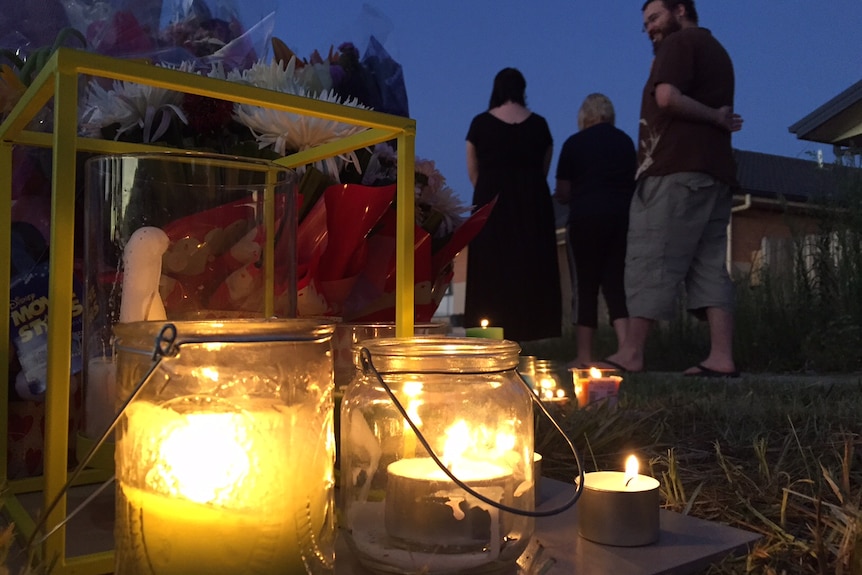 People attend a candle-lit vigil last night for Bradyn Dillon.