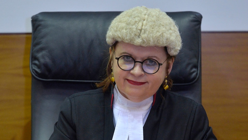 Supreme Court Justice Jenny Blokland sits at her desk.