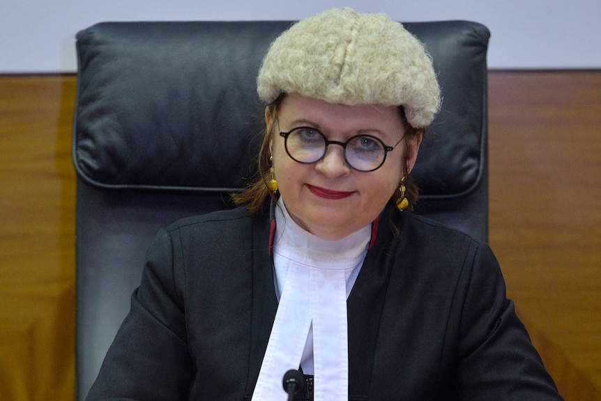 Supreme Court Justice Jenny Blokland sits at her desk.