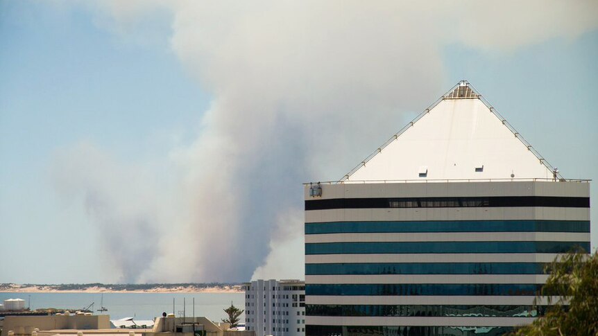 Smoke from a bushfire in the far distance is seen rising into the sky from Bunbury.