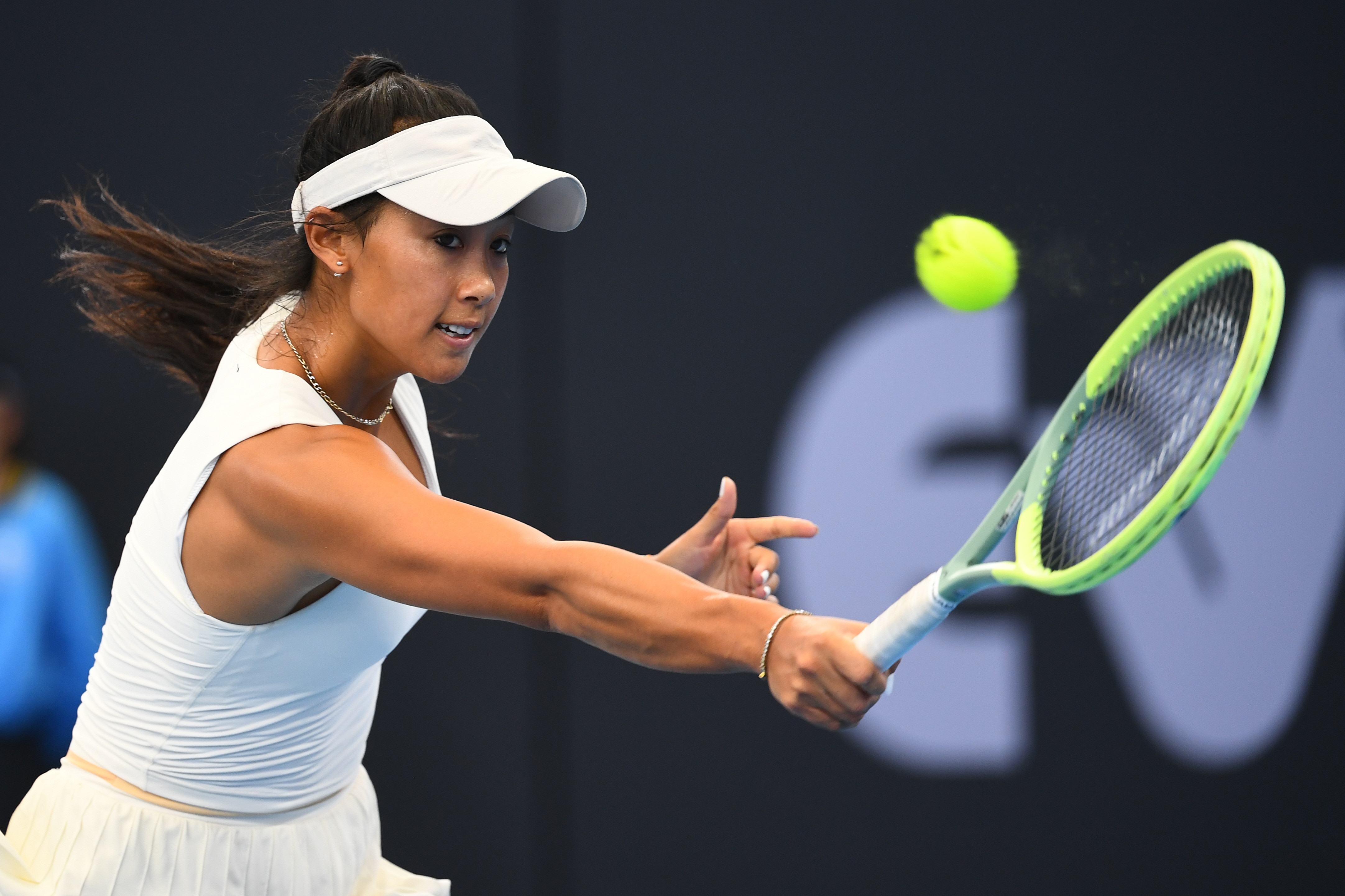 Priscilla Hon stretches for a backhand.