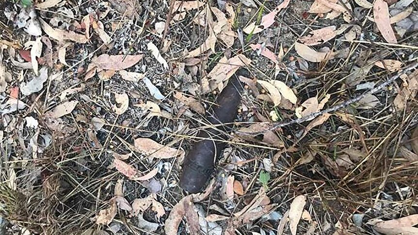 A photo of a piece of unexploded ordnance discovered on the ground in Litchfield National Park.