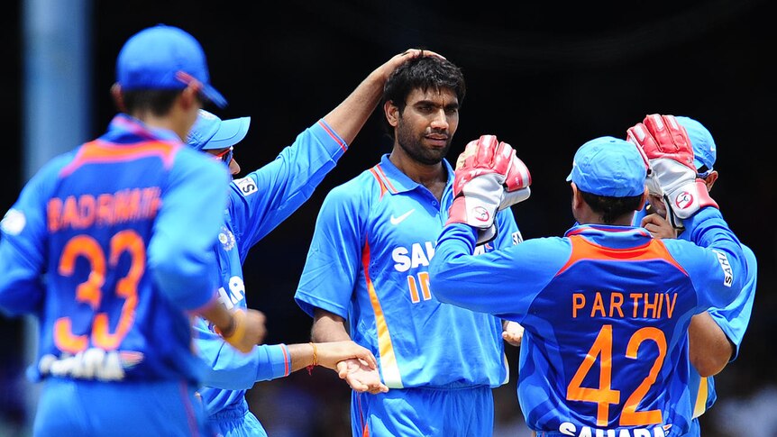 First win ... India celebrates Munaf Patel's wicket of Andre Fletcher.