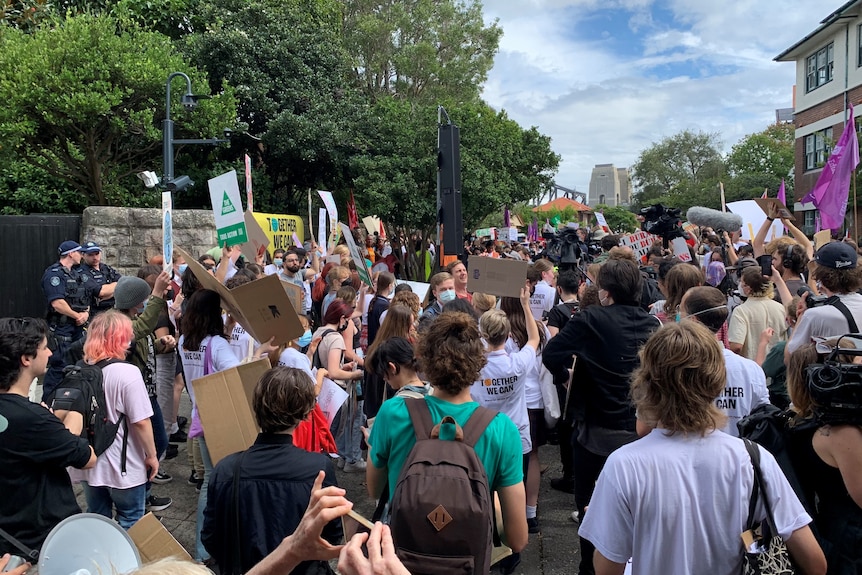 Hundreds of kids march down a street