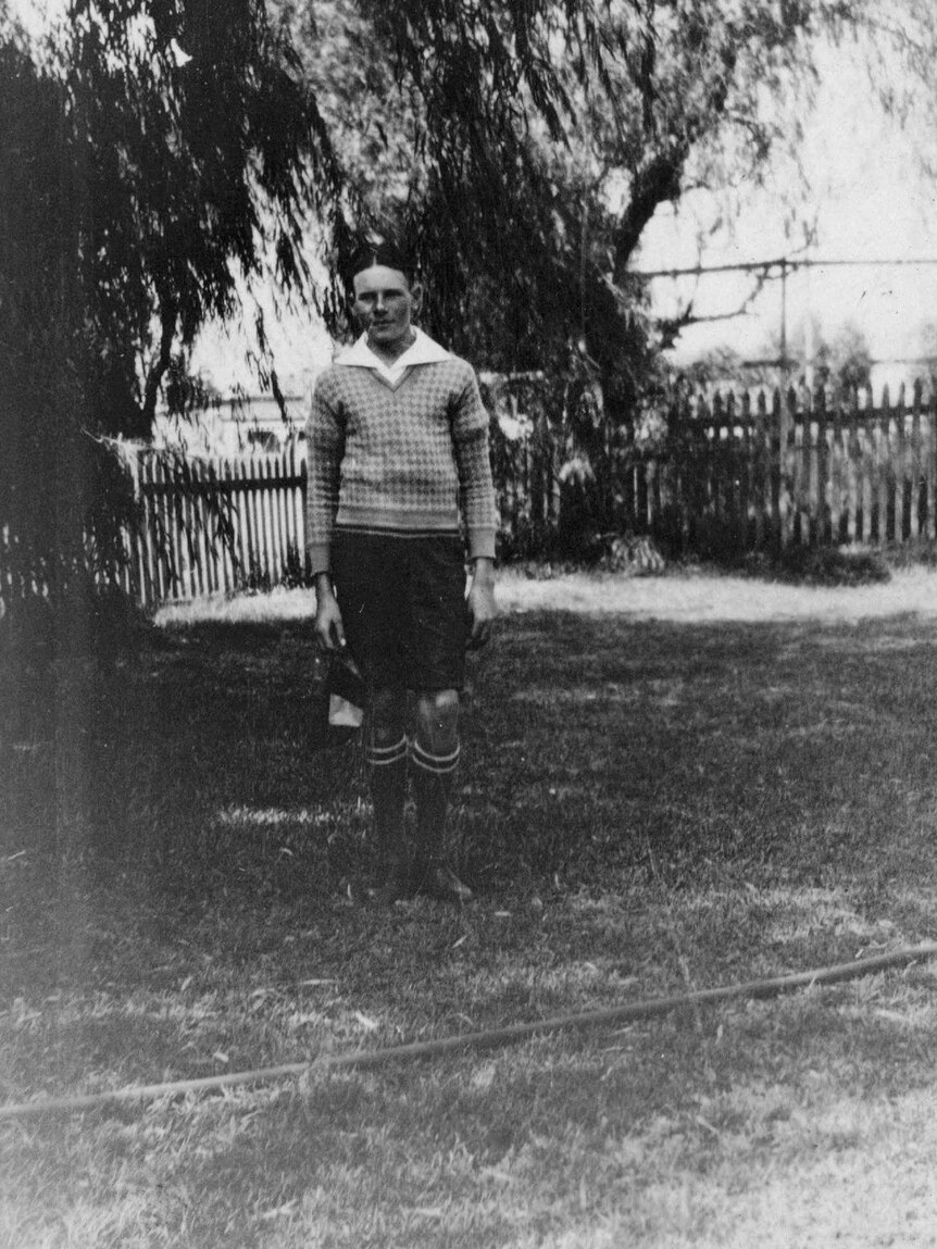 Hugh Brockway, 15, stands in a yard in 1933.