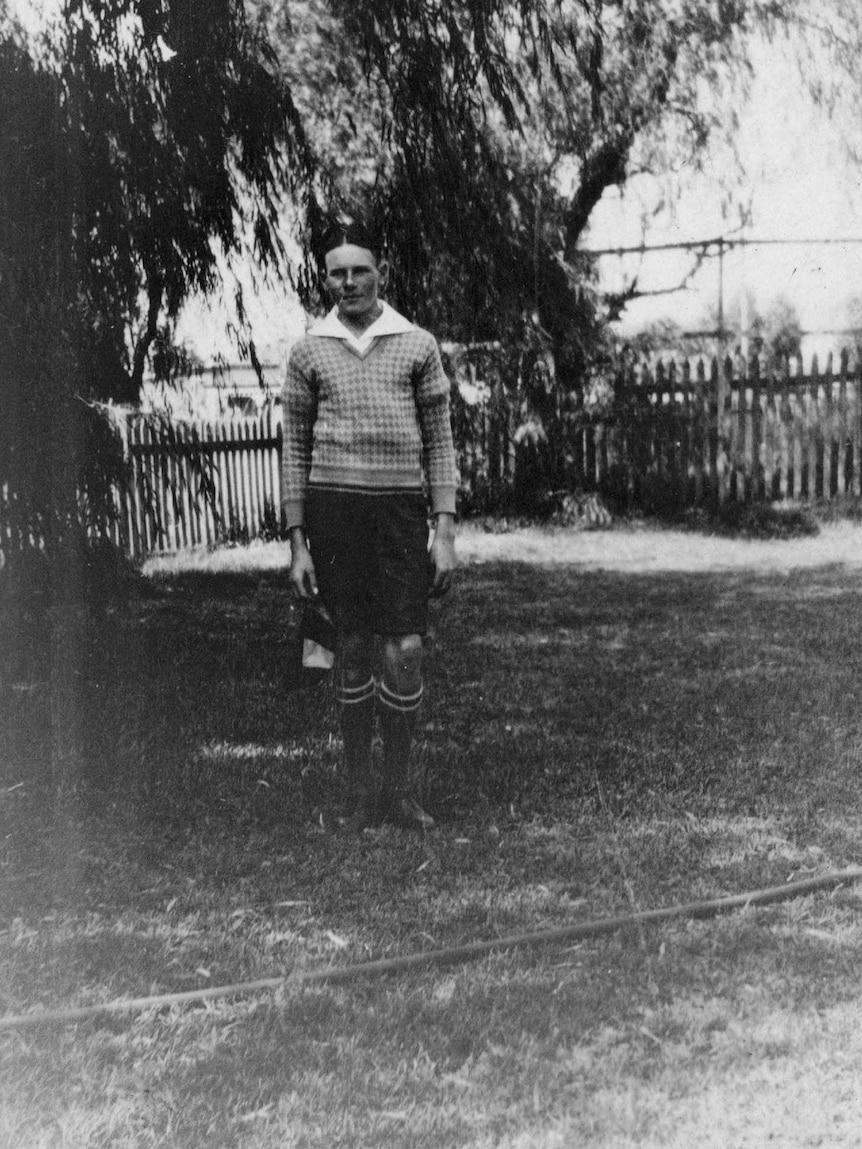 Hugh Brockway, 15, stands in a yard in 1933.