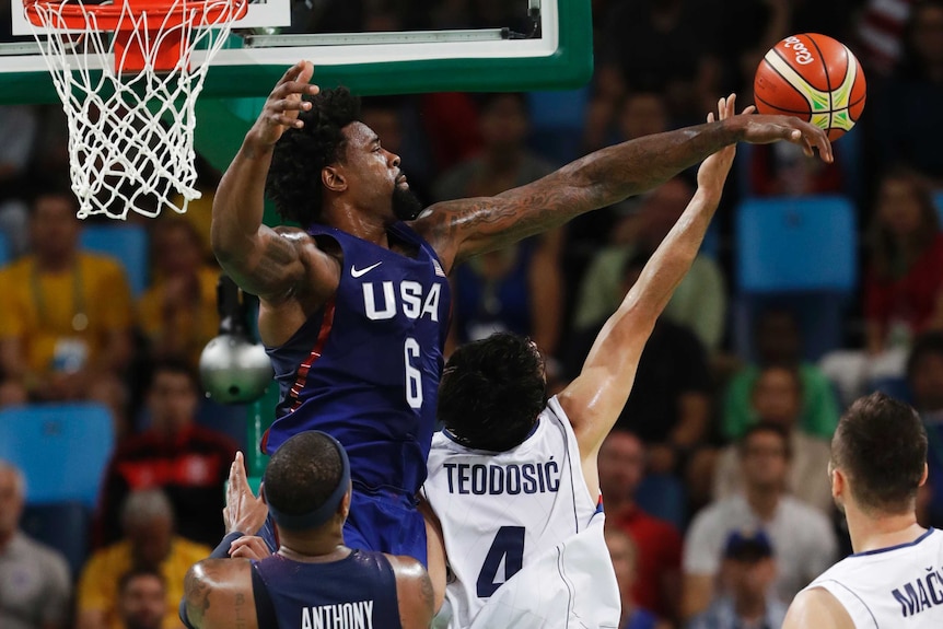 DeAndre Jordan blocks a shot by Serbia's Milos Teodosic.