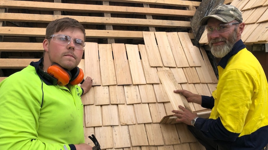 Heritage construction apprentice Jai Webber making roof shingles with builder Graham Green