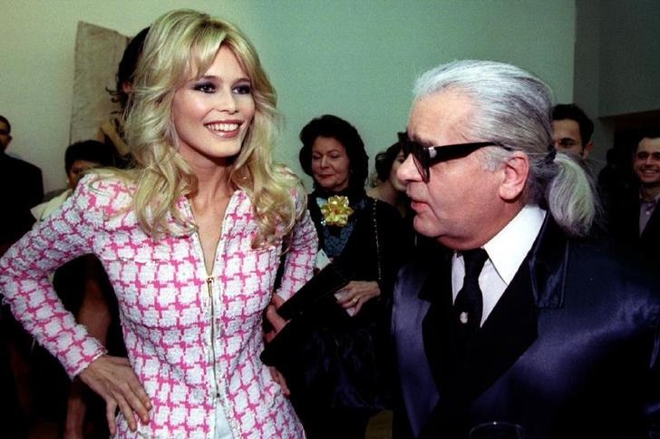 Supermodel Claudia Schiffer is pictured standing alongside fashion designer Karl Lagerfeld at an event in 1994