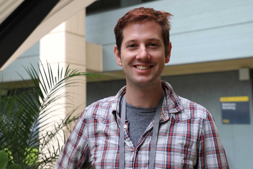 James smiles at camera. His hair is sticking up a bit awkwardly, I should have fixed it when taking the picture.