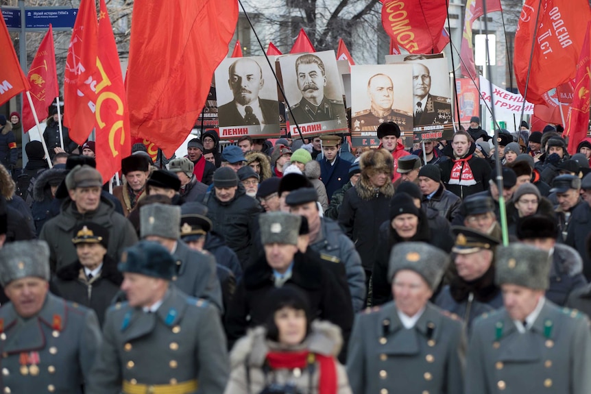 Russian Communist Party members march during Defender of the Fatherland Day