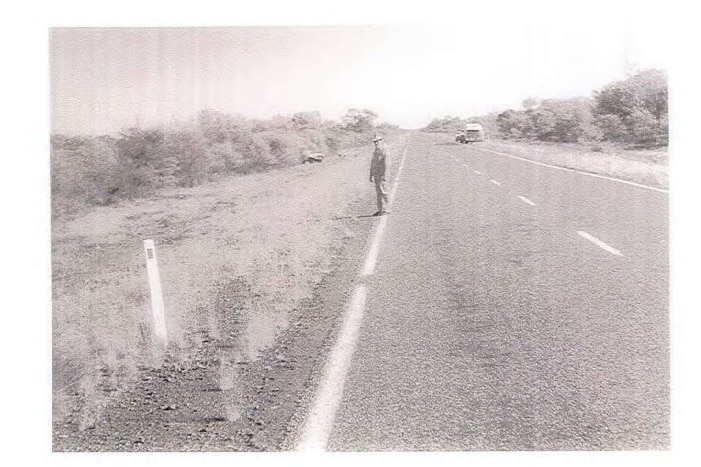 Black and white photograph of an outback road