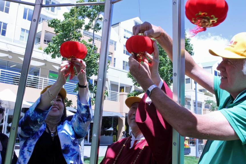 Hobart Lord Mayor Sue Hickey decorates metal tree