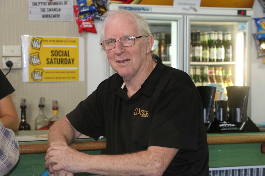 Publican Col Hunt sits at the bar in Dalby.