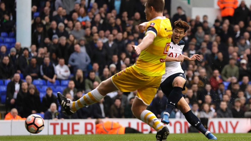Son Heung-min (R), scores his third goal for Spurs against Millwall in the FA Cup quarter-final.
