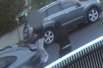 A CCTV image of two men.