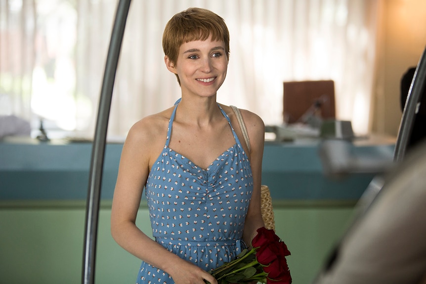 Colour still of Rooney Mara smiling in 2018 film Don't Worry, He Won't Get Far on Foot.