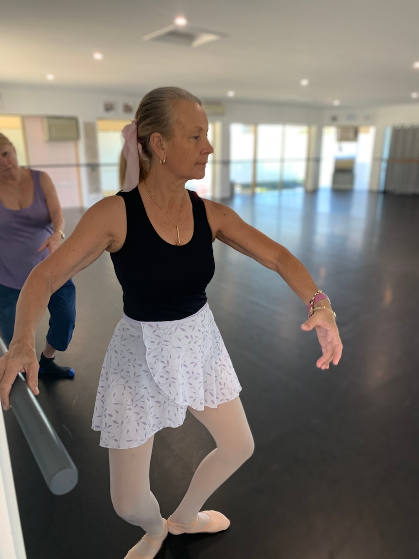 62 year old Vicky Seedsman in ballet outfit practicing pose during a class at Robina studio 