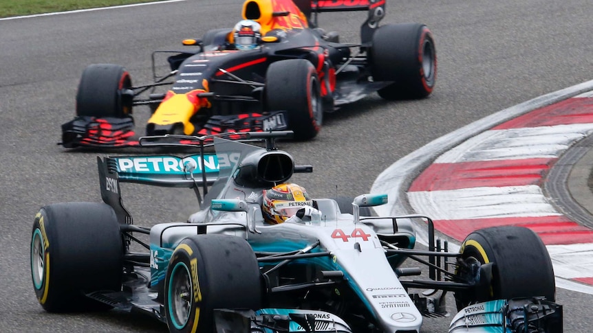 Lewis Hamilton in his Mercedes leads Daniel Ricciardo in his Red Bull