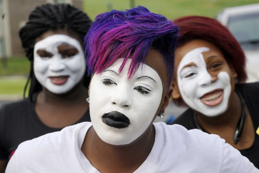 Black protesters don whiteface to mark Ferguson shooting anniversary