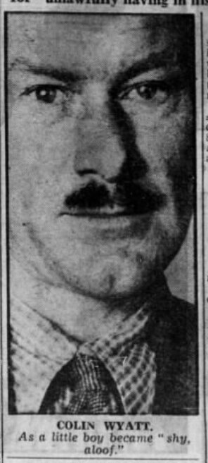 A tall, narrow black-and-white newspaper photo showing a portrait of a man with a small moustache.
