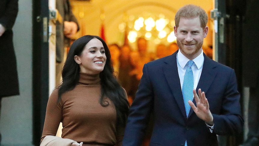 Meghan and Harry, the Duke and Duchess of Sussex walk arm in arm