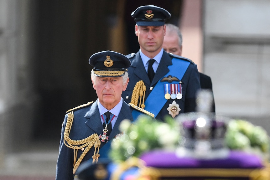 King Charles in focus behind Queen Elizabeth II's coffin. 