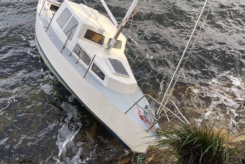 Boat aground off the Tasmanian coast, July 2019.