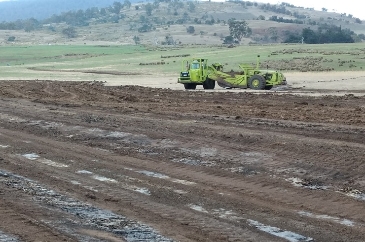 Scraper at work on The Square on Will Bignell's property near Bothwell