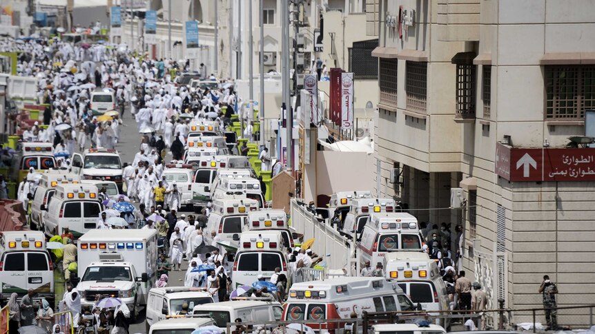 Saudi ambulances arrive with pilgrims who were injured in a stampede at an emergency hospital in Mina Sep 2015