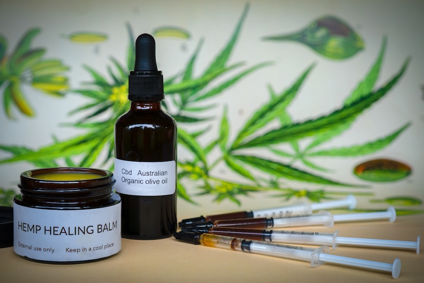 A bottle with dropper, an ointment jar and syringes, all labelled as containing medicinal hemp products.