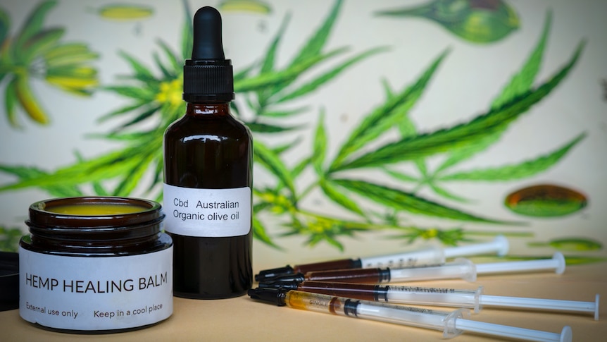 A bottle with dropper, an ointment jar and syringes labelled as containing medicinal hemp products