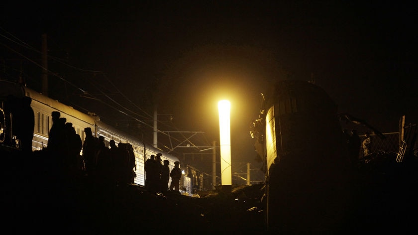 Rescuers work at the site of the train derailment near the village of Uglovka, about 400 km northwest of Moscow.