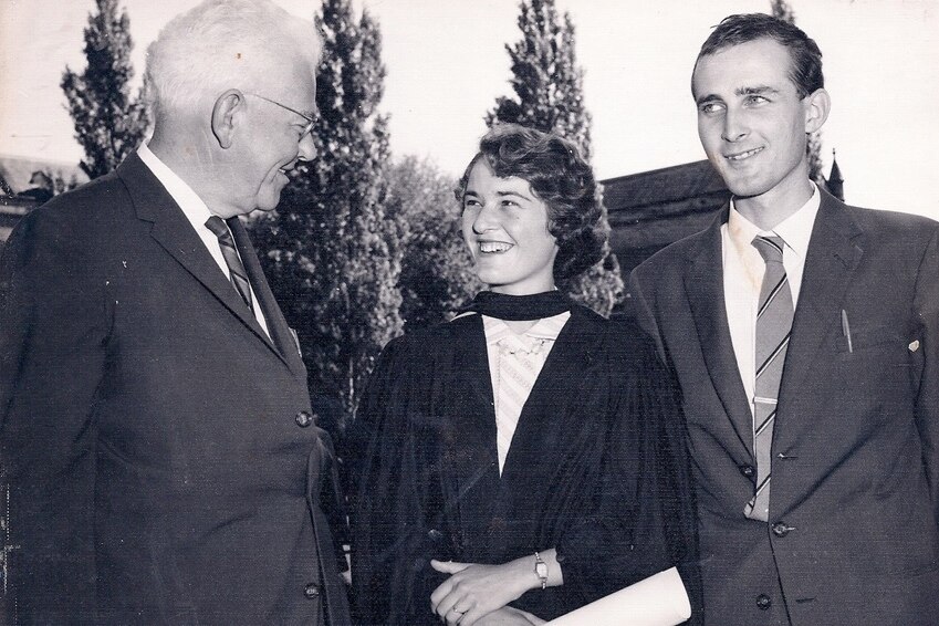 Black and white photo of Mark Oliphant with Monica and her husband Michael at her graduation.