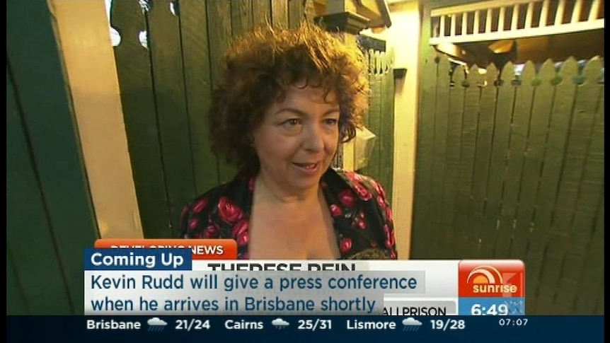 Therese Rein speaks to reporters on her way to Brisbane airport