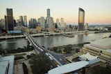 Brisbane city buildings, Victoria Bridge, QPAC, South East Freeway and river at dusk.